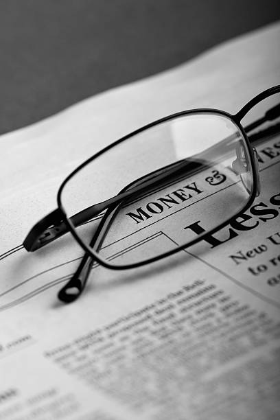istock Business newspaper and glasses 94293095