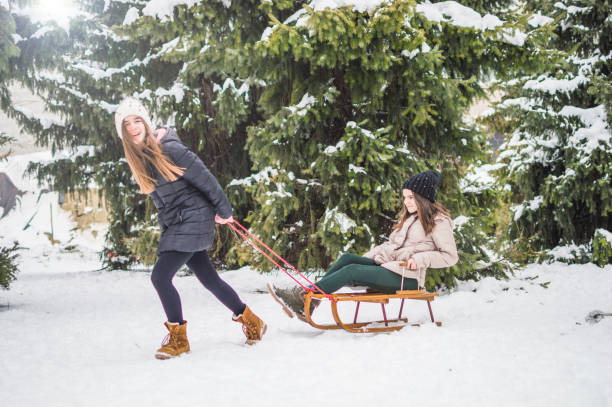Sister twins having fun on snow