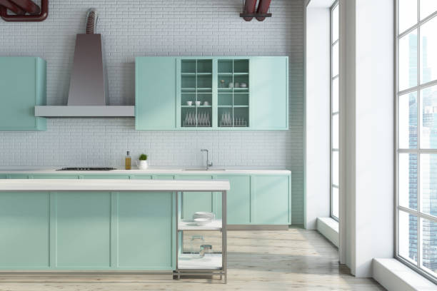 istock White kitchen, green countertops close up 942933260