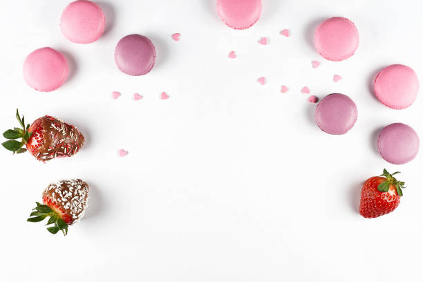 Strawberries in chocolate and macaron
