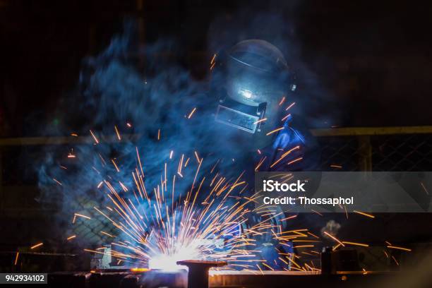 Worker Is Welding Automotive Part In Car Factory Stock Photo - Download Image Now - Welder, Welding, Tungsten - Metal