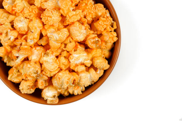 istock yellow delicious roasted popcorn in a clay brown plate 942941630