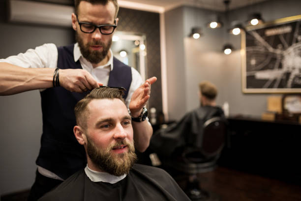 istock Glad customer having hair cut at salon 942948634