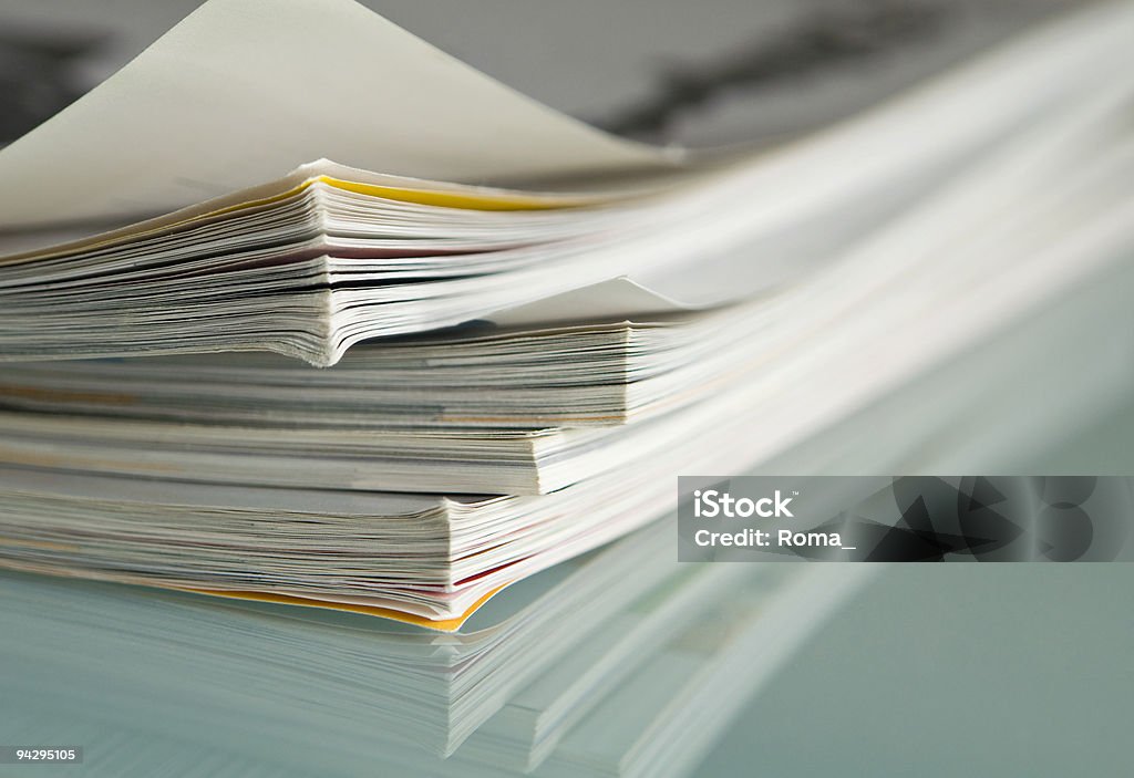 Close up of corner of stack of magazines Stacked magazines. Close-up shot. Almanac - Publication Stock Photo