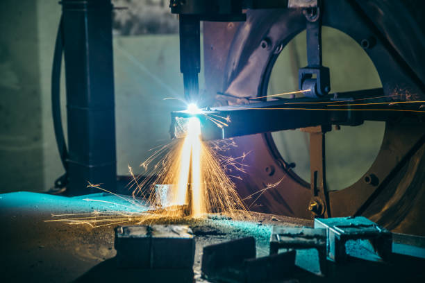 istock Laser cutting of metal bars with sparks 942951650