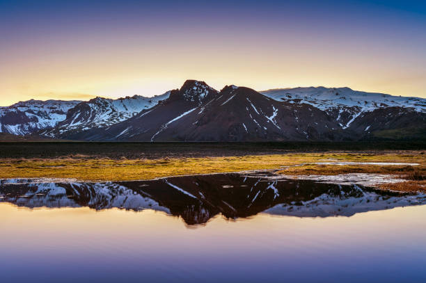 istock Winter mountains reflection at sunset in a lake. 942951802