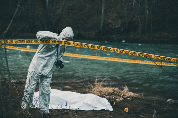 istock Forensic photographer leaving crime scene 942955204