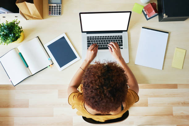 young woman working from home - above laptop desk computer imagens e fotografias de stock