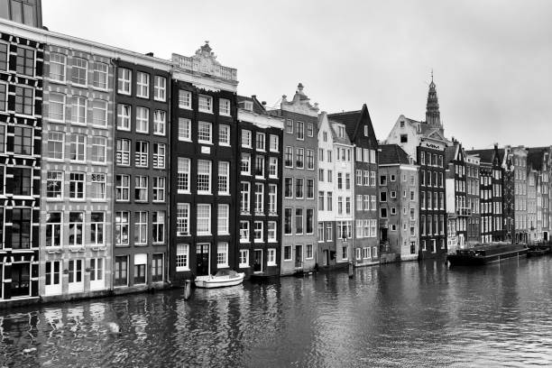 istock Typical Dutch houses built by the canal, Amsterdam 942970098