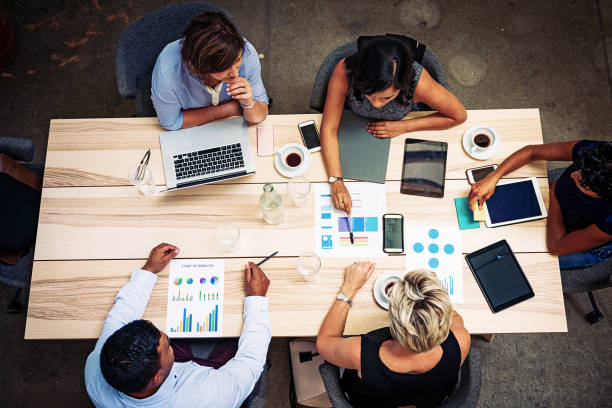 istock Mature business people making various decisions together 942976490