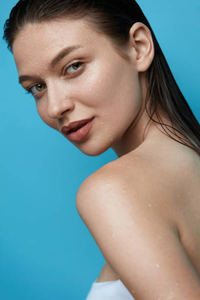 istock Beautiful Woman With Water Drops On Skin. 942979014