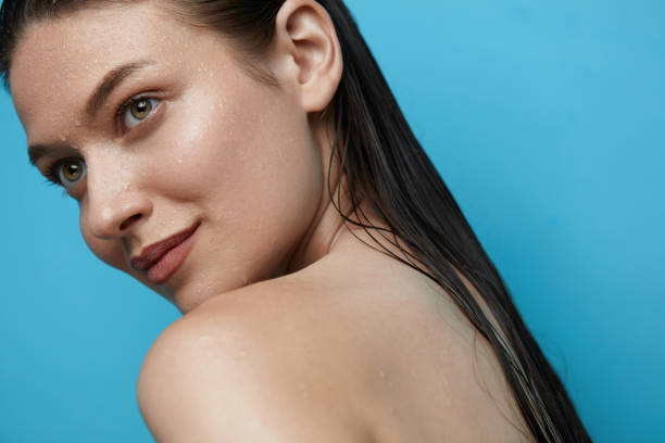 istock Beautiful Woman With Water Drops On Skin. 942979090