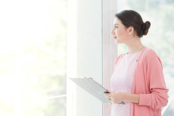 istock Business woman standing working 942982534
