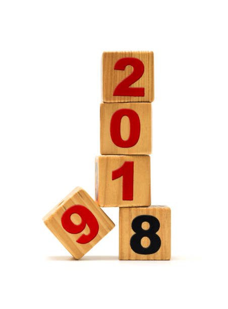 istock New Year 2019 and Old 2018 with wood block isolated 942984982