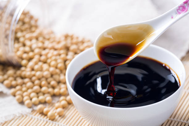 istock Soy sauce poured from a spoon 942985250