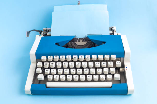 istock Retro vintage typewriter isolated on blue minimalistic concept. 942993010