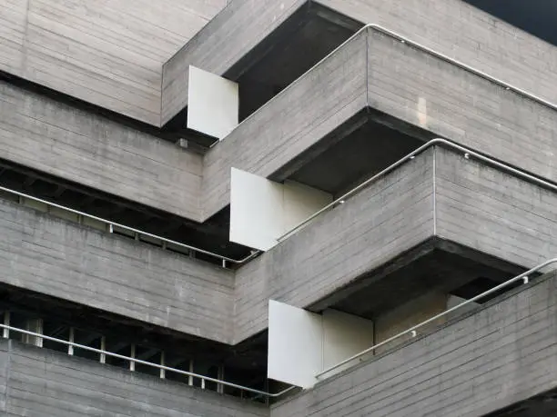 details of railings and balconies on an old brutalist concrete building