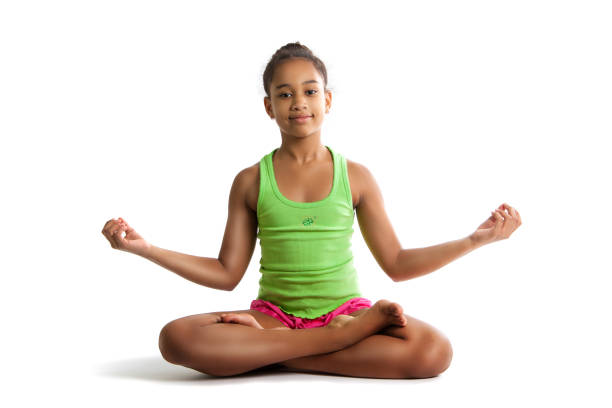 little girl sitting in lotus position and hands up. isolated on white background. - gymnastics smiling little girls only isolated on white imagens e fotografias de stock