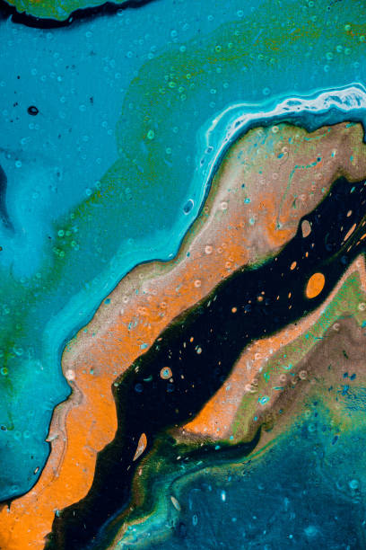 istock abstract background with blue and orange oil paint 943004186