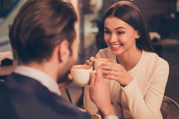 istock Happy romantic couple sitting in a cafe with coffee 943004656