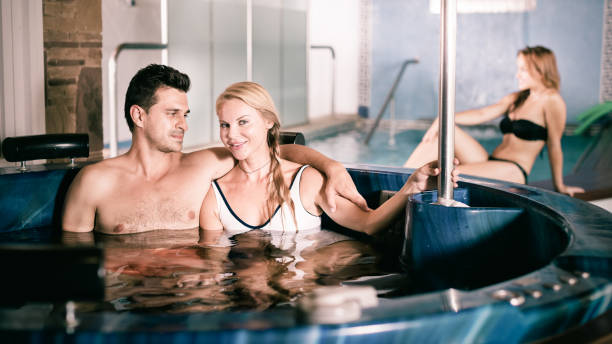 istock Woman with man are talking in pool 943005570