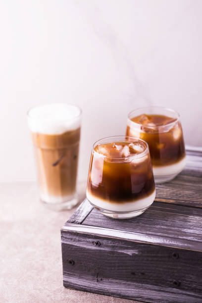 istock Iced coffee in glasses with milk. Black background 943007902