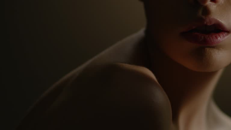 Beautiful female face closeup. Fashion video. Slow motion. 4K 30fps ProRes 4444