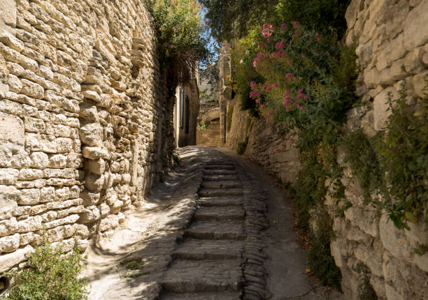 Steep alley with medieval houses in Gordes. Provence, France stock photo