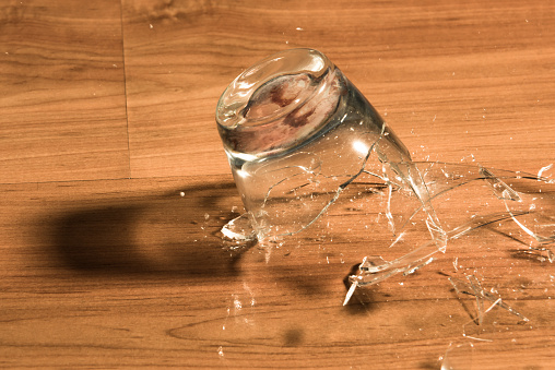 Breaking of a glass on a wood floor