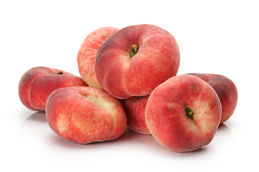 Group of ripe whole peach fruit with half and slice isolated on white background. Peaches with clipping path. Full depth of field.