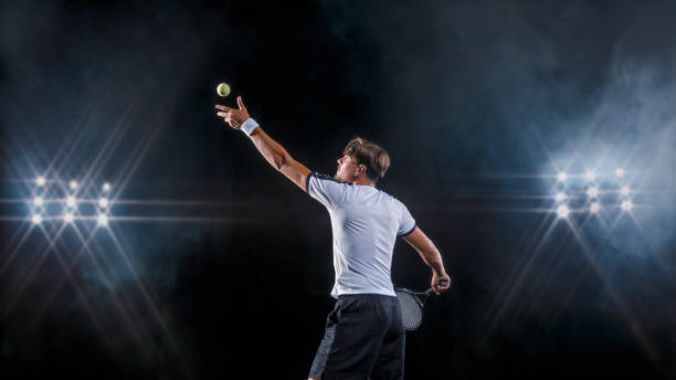 istock Male tennis player serving 943018748