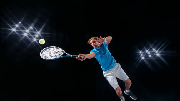 istock Male tennis player hitting ball 943018784
