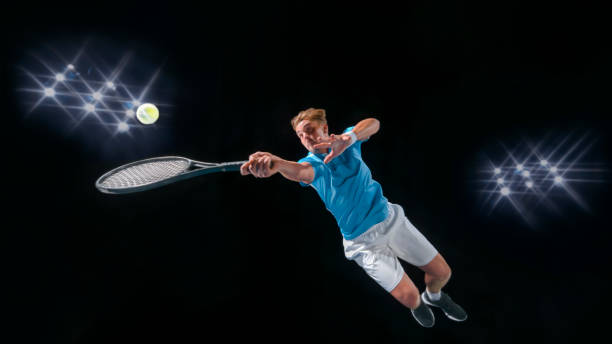 istock Male tennis player hitting ball 943018790