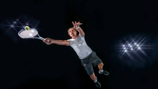 istock Male tennis player hitting ball 943018794