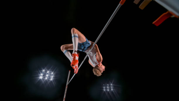 istock High jumper jumping over bar 943018798