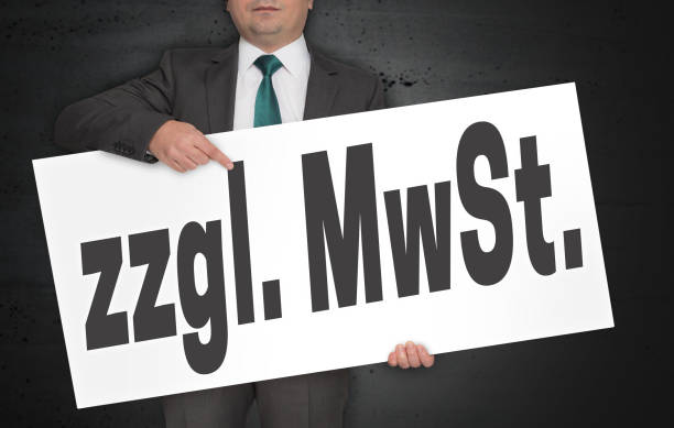 istock zzgl. MwSt. (in german plus VAT.) Poster is held by businessman 943031312