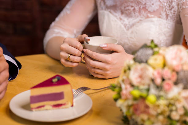 istock girl drinks coffee with fruit cakes at a cafe 943034464