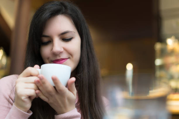 istock Brunette Beauty With Coffee in Coffee Shop 943035126