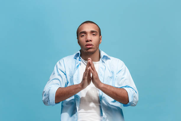 istock The serious businessman standing and looking at camera against studio background 943035362
