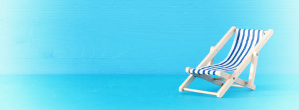istock image of beach chair over blue background. 943041204