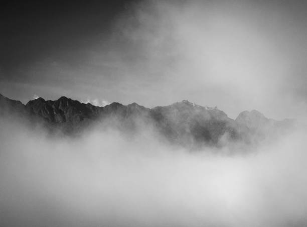 istock Mountains with clouds in black and white 943041278