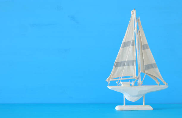 istock nautical concept with sail boat over blue background. 943041634