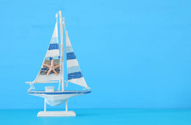 istock nautical concept with sail boat over blue background. 943041662
