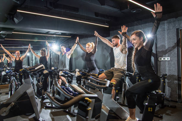 330+ Woman Training On Indoor Stationary Cycling Fitness Bike