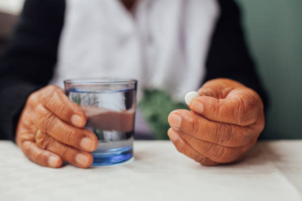 istock Senior woman taking pills 943046472