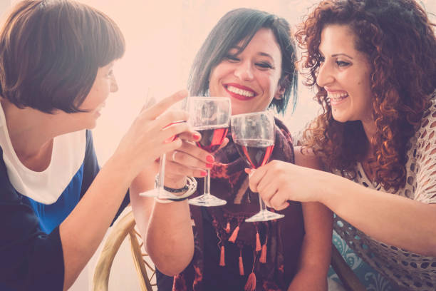 istock three best friends drinking win with happiness 943058134
