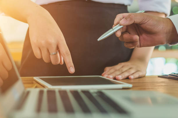 istock Business people at working with financial reports and a tablet 943058284