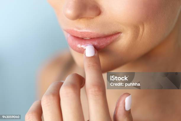 Lips Protection Closeup Of Healthy Woman Lips And Smooth Skin Stock Photo - Download Image Now