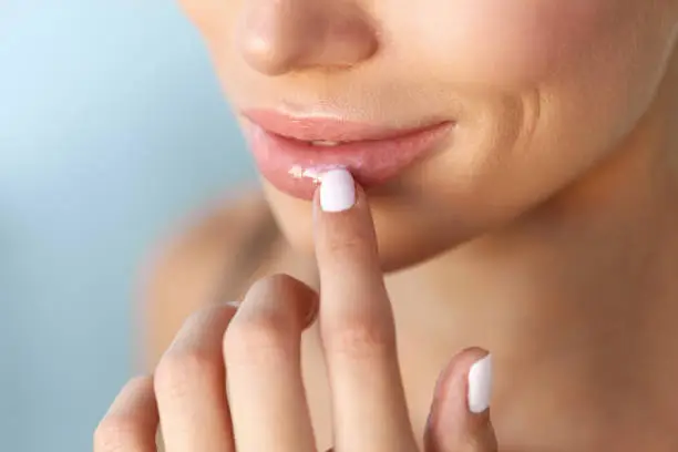 Photo of Lips Protection. Closeup of Healthy Woman Lips And Smooth Skin