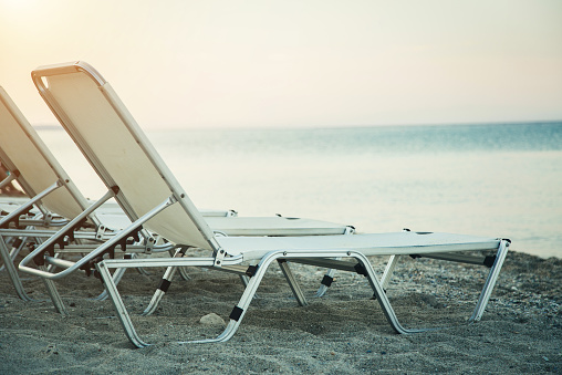 loungers, deck chairs on a beautiful beach to enjoying